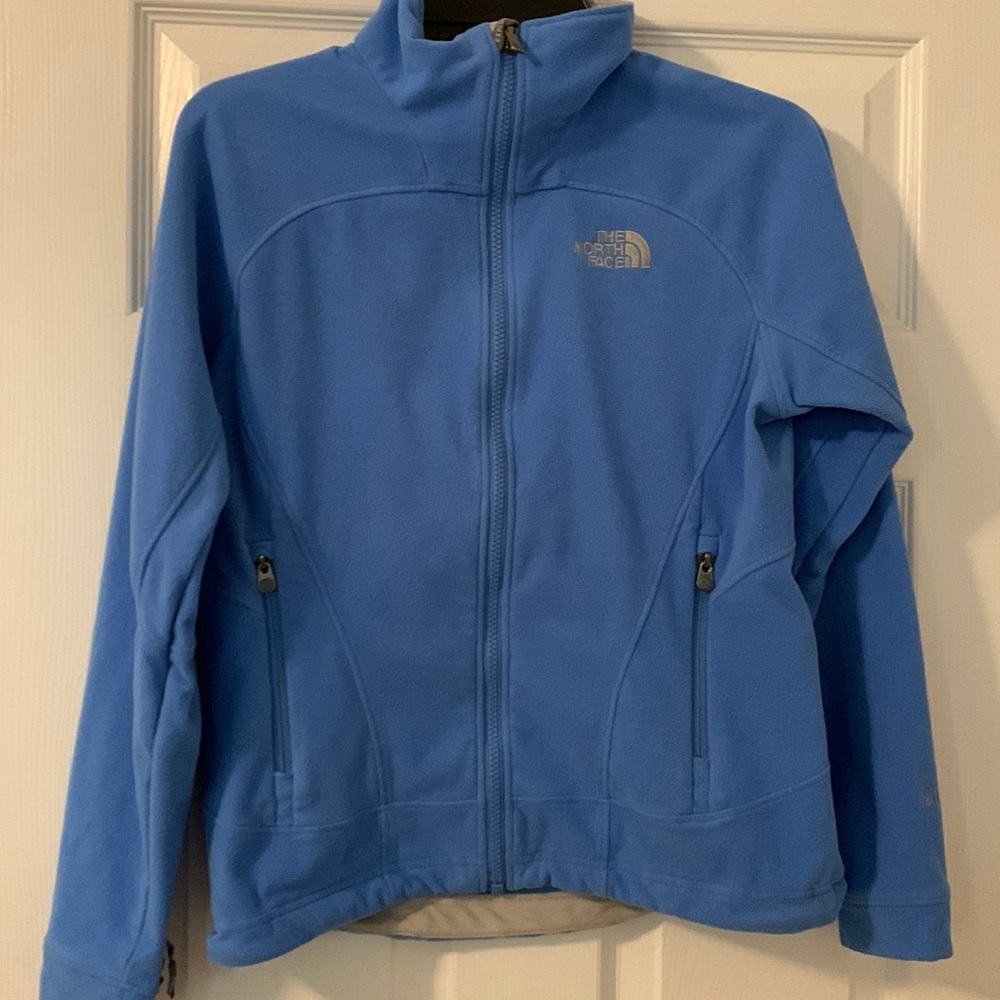 Woman’s NorthFace light blue fleece zippered jacket. Size S/P